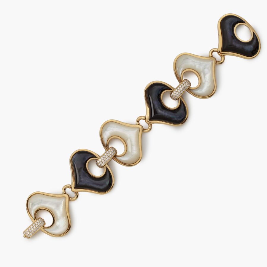 An eighteen carat yellow gold bracelet set with white and black mother of pearl and diamonds. Signed Marina B. and numbered. Made in Italy, ca 2000.