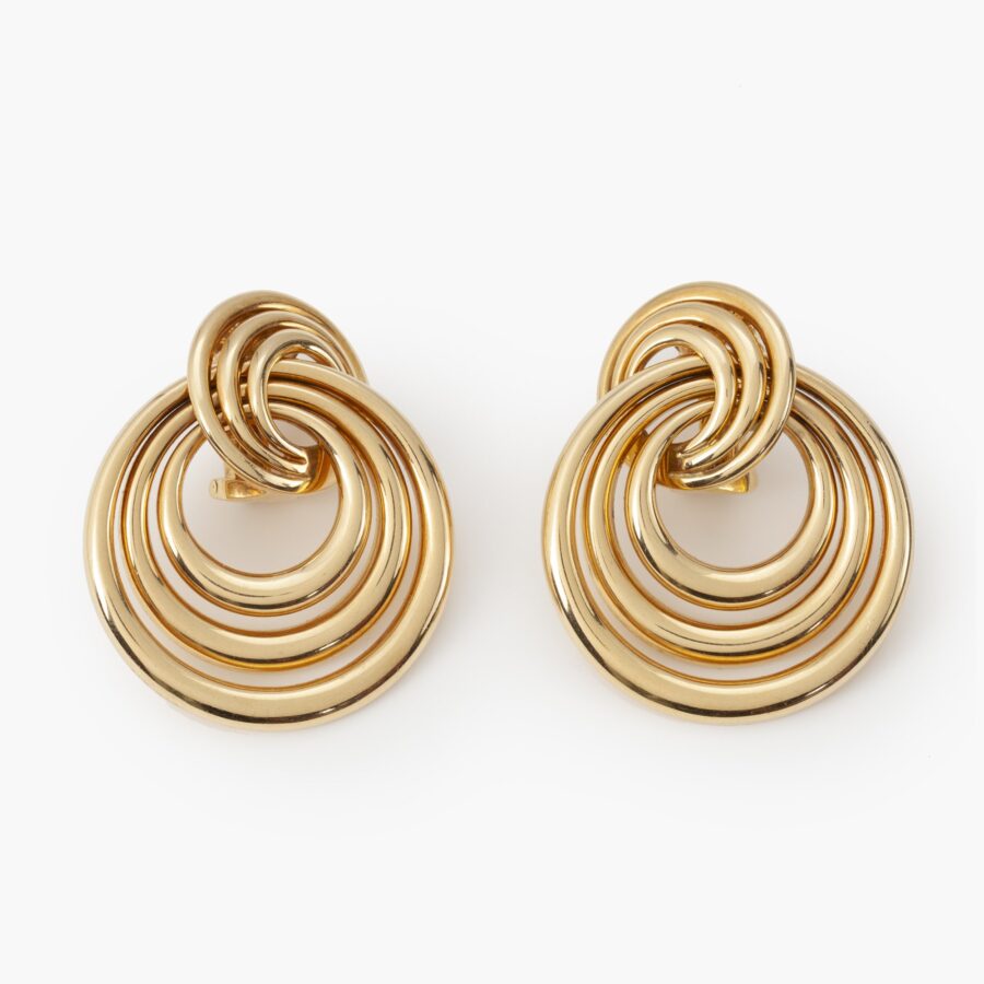A pair of eighteen carat yellow gold earrings made of many concentric rings. Signed Cartier and numbered, dated 1993.