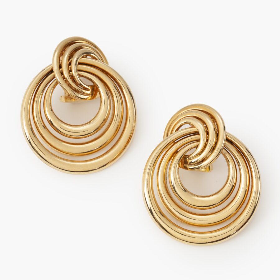 A pair of eighteen carat yellow gold earrings made of many concentric rings. Signed Cartier and numbered, dated 1993.