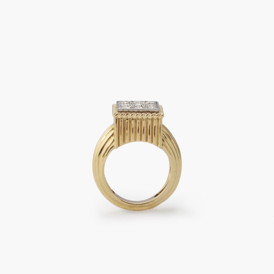 An eighteen carat yellow gold and platinum ring pavé set with brilliant cut diamonds. Signed Cartier Paris and numbered, made ca 1970.