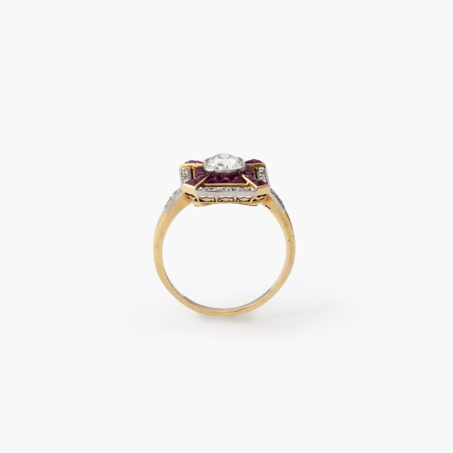 An eighteen carat yellow gold and platinum Art Deco ring, set with old brilliant cut diamonds and calibré cut rubies, made in France, ca 1910.