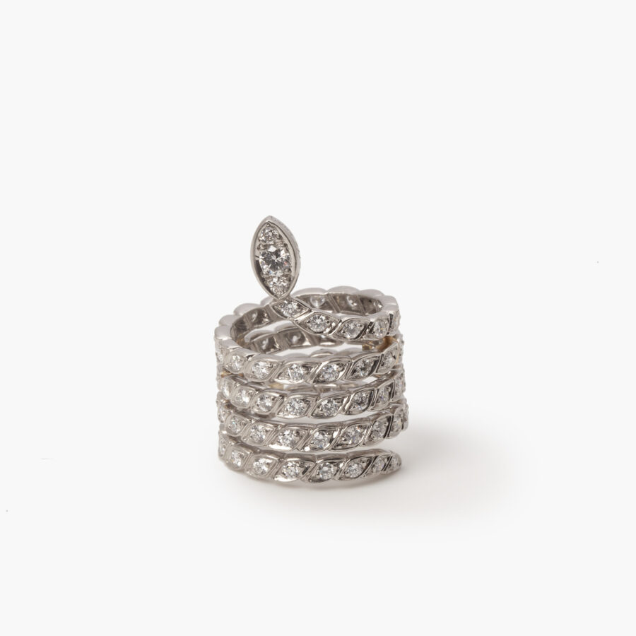 A platinum ring designed as a snake set with brilliant cut diamonds. Signed Sterlé and numbered, made in Paris, ca 1960. 