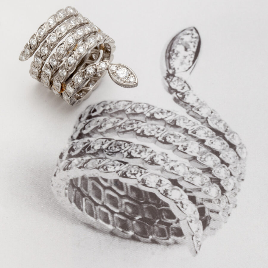 A platinum ring designed as a snake set with brilliant cut diamonds. Signed Sterlé and numbered, made in Paris, ca 1960. 