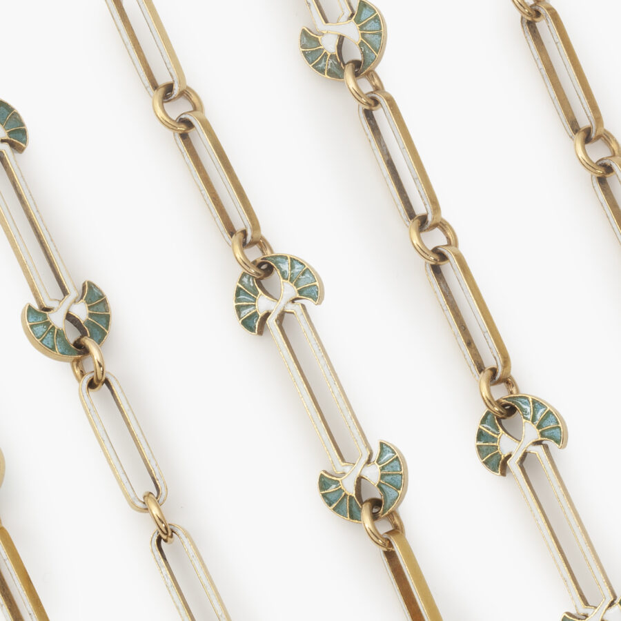 An eighteen carat yellow gold Art Nouveau longchain decorated with white and bluish-green enamel. Signed Lalique, made in France, ca 1900.