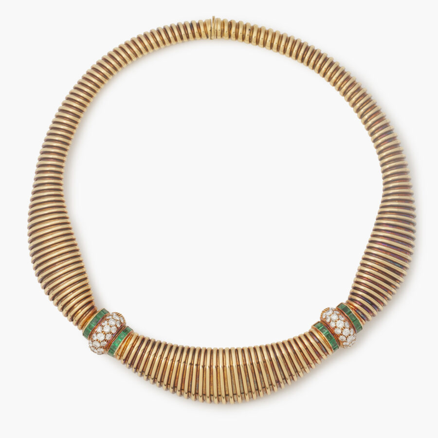 An eighteen carat yellow gold necklace, set with diamonds and emeralds. Signed Cartier and numbered. Made in Italy, ca 1965. With IAJA certificate.