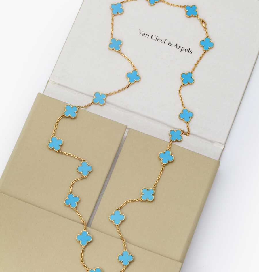 An eighteen carat yellow gold “Alhambra” longchain set with turquoise. Signed Van Cleef & Arpels and numbered. With pouch and certificate dated 2007.