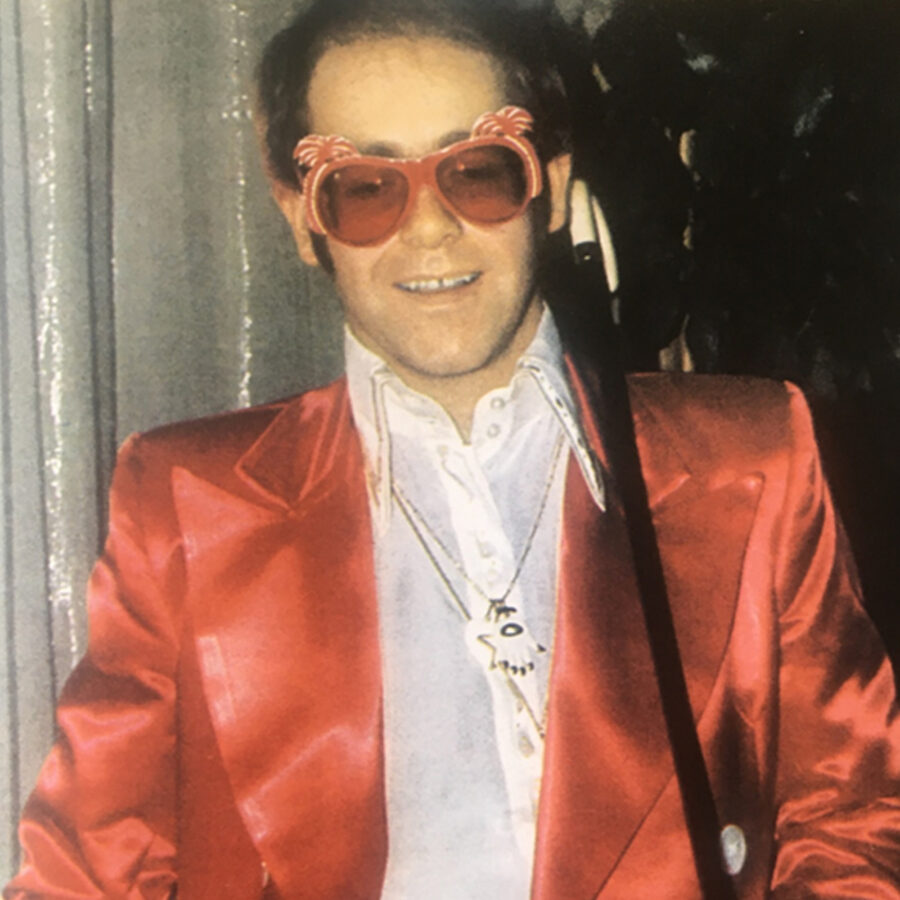 Elton John wearing a white “Hamsa” pendant by Aldo Cipullo