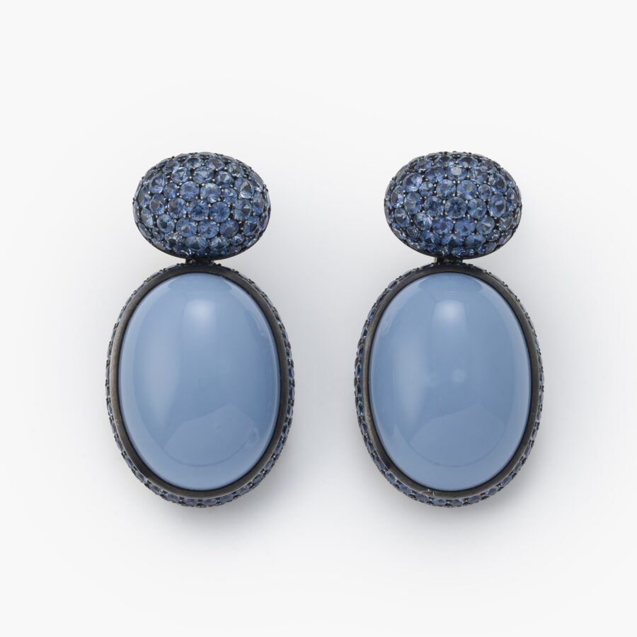 A pair of eighteen carat white gold and blackened silver earrings set with opaque blue opal and facetted blue sapphires. Signed Hemmerle, made in Munich.