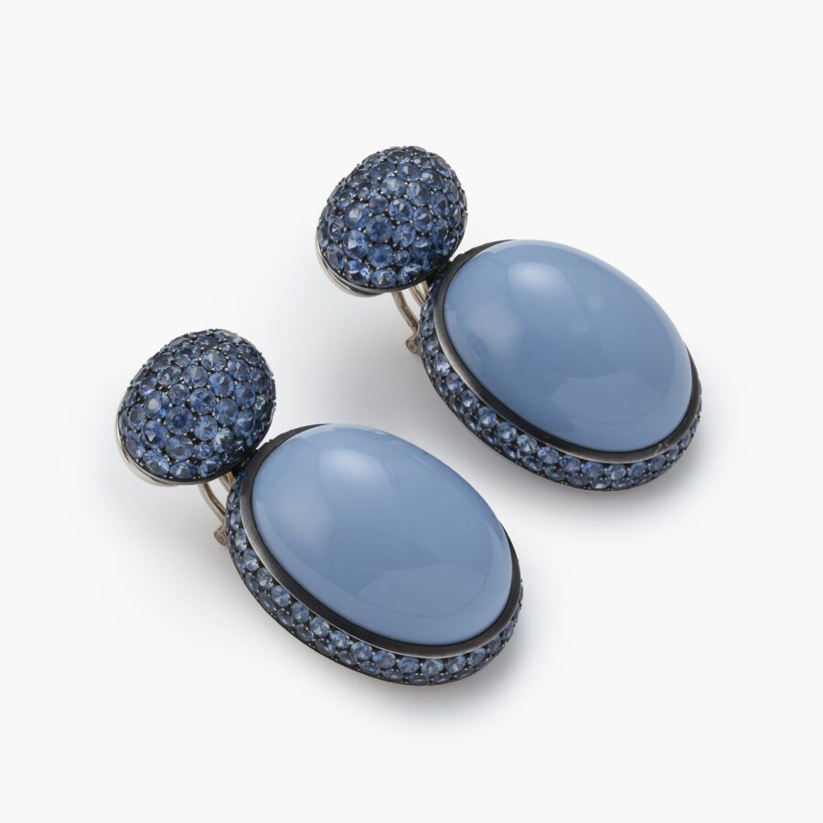 A pair of eighteen carat white gold and blackened silver earrings set with opaque blue opal and facetted blue sapphires. Signed Hemmerle, made in Munich.