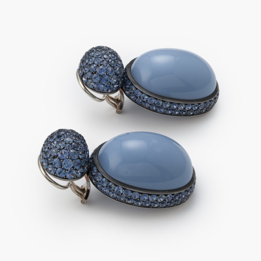 A pair of eighteen carat white gold and blackened silver earrings set with opaque blue opal and facetted blue sapphires. Signed Hemmerle, made in Munich.