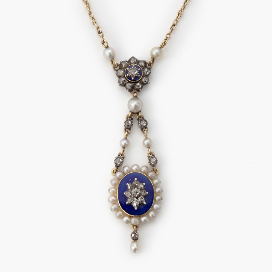 An antique eighteen carat yellow gold and silver lavalière necklace set with pearls and diamonds and decorated with enamel. Made in France, ca 1900.