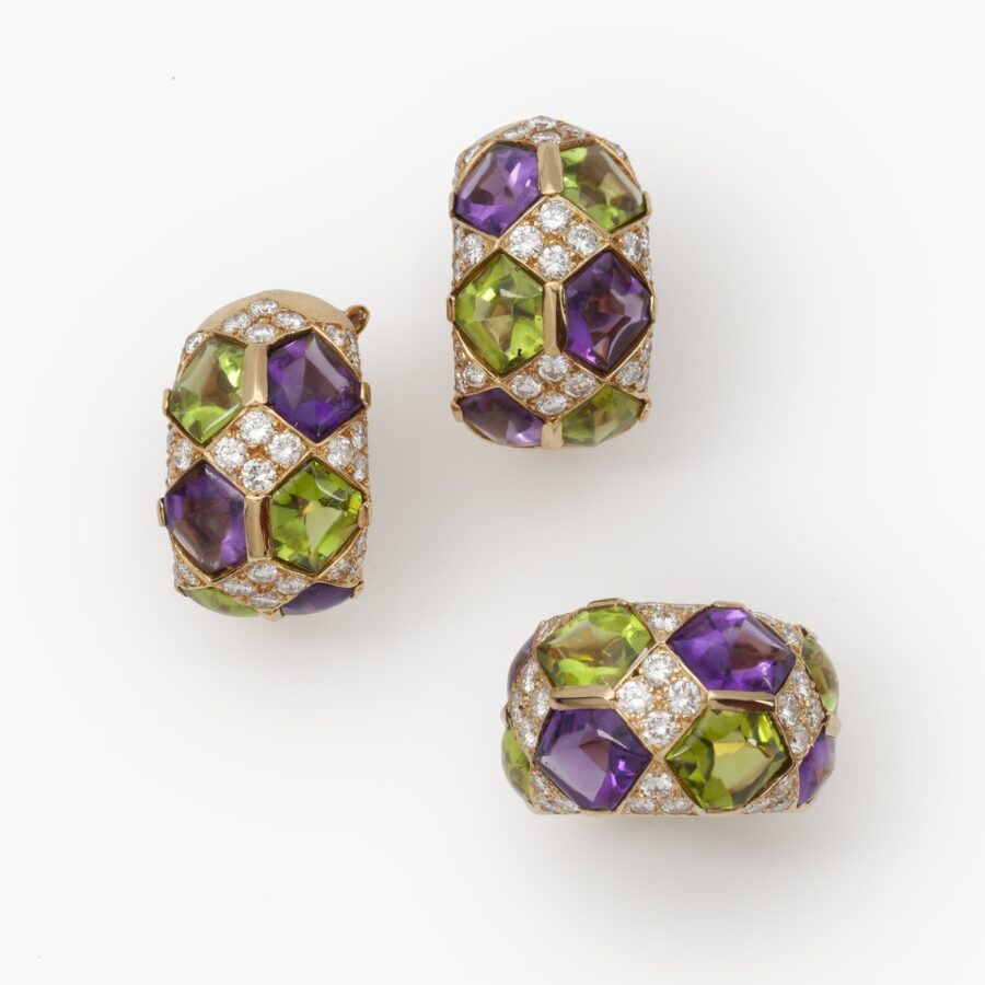 A pair of eighteen carat yellow gold clip earrings with matching ring, set with diamonds, amethysts and peridots. Van Cleef & Arpels, Paris, ca 1990. 