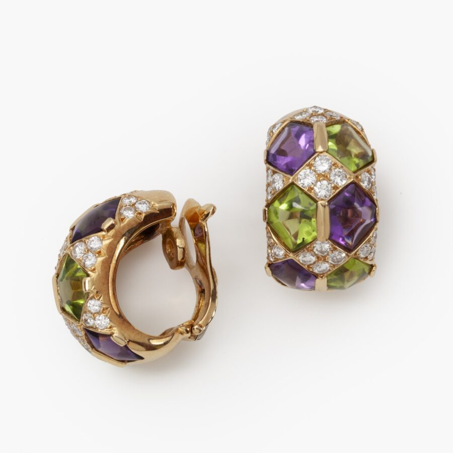 A pair of eighteen carat yellow gold clip earrings with matching ring, set with diamonds, amethysts and peridots. Van Cleef & Arpels, Paris, ca 1990. 