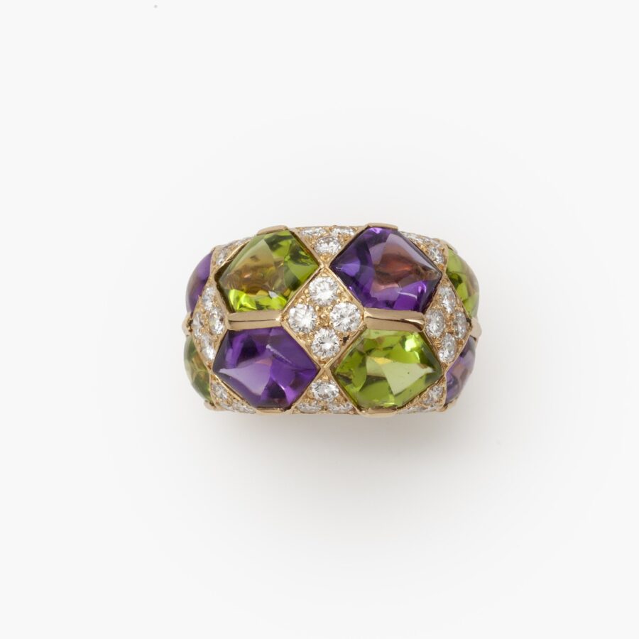 A pair of eighteen carat yellow gold clip earrings with matching ring, set with diamonds, amethysts and peridots. Van Cleef & Arpels, Paris, ca 1990. 