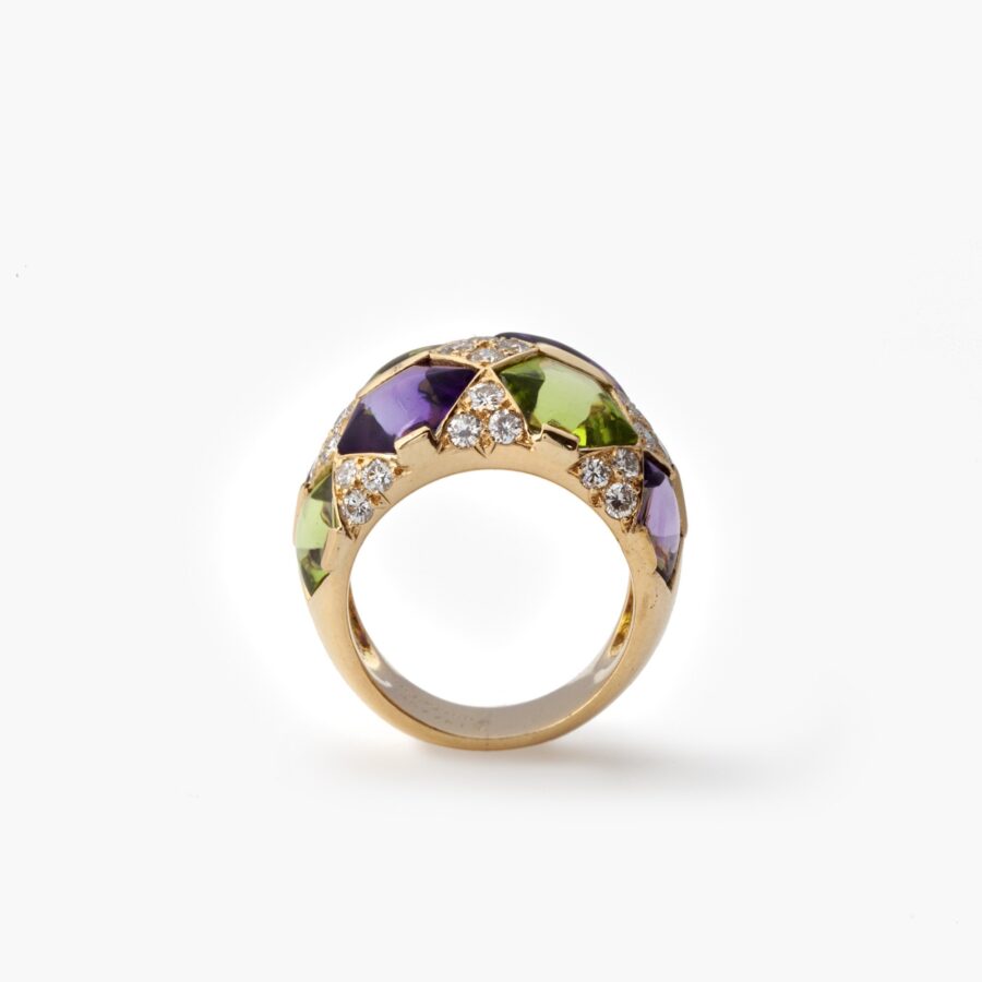 A pair of eighteen carat yellow gold clip earrings with matching ring, set with diamonds, amethysts and peridots. Van Cleef & Arpels, Paris, ca 1990. 