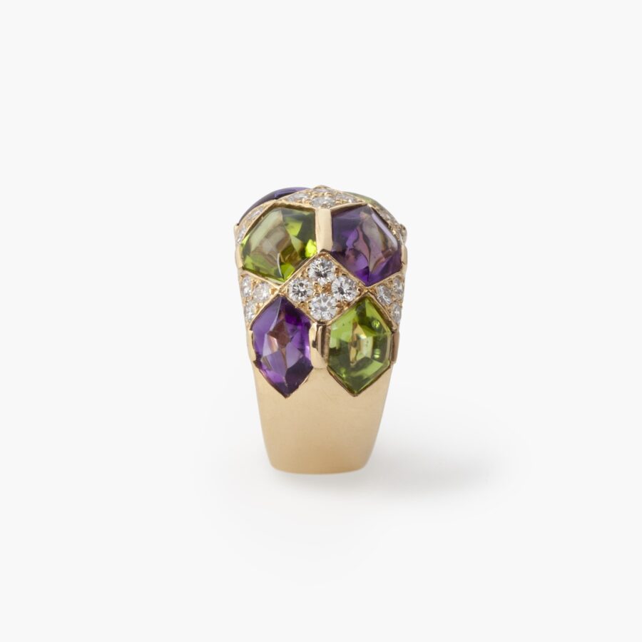 A pair of eighteen carat yellow gold clip earrings with matching ring, set with diamonds, amethysts and peridots. Van Cleef & Arpels, Paris, ca 1990. 