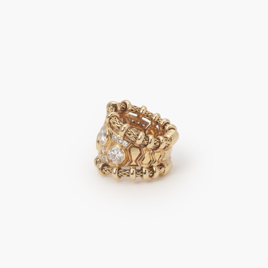 An eighteen carat yellow gold ring “Passementerie”, set with brilliant cut diamonds. Signed Rene Boivin, made in Paris, ca 1950.