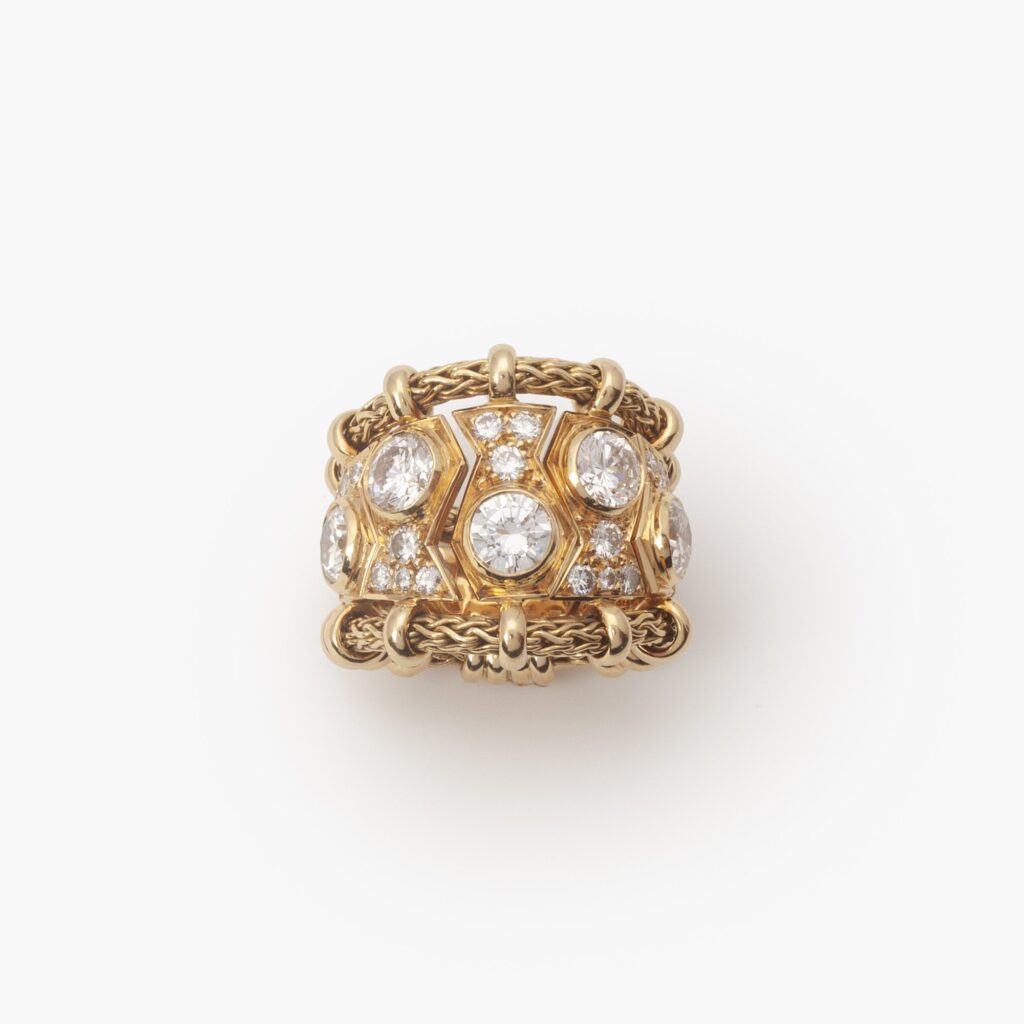 An eighteen carat yellow gold ring “Passementerie”, set with brilliant cut diamonds. Signed Rene Boivin, made in Paris, ca 1950.