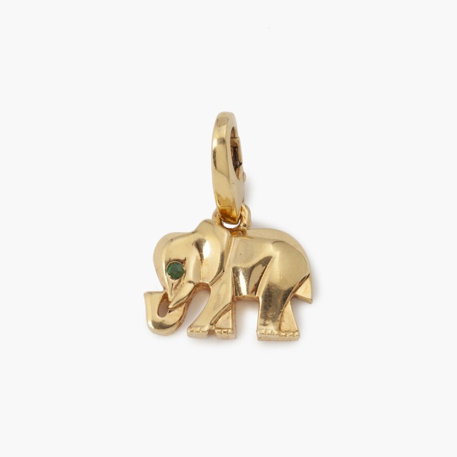 An eighteen carat yellow gold pendant designed as an stylized elephant with an emerald for an eye. Signed Cartier and numbered, made in Paris, ca 2000.