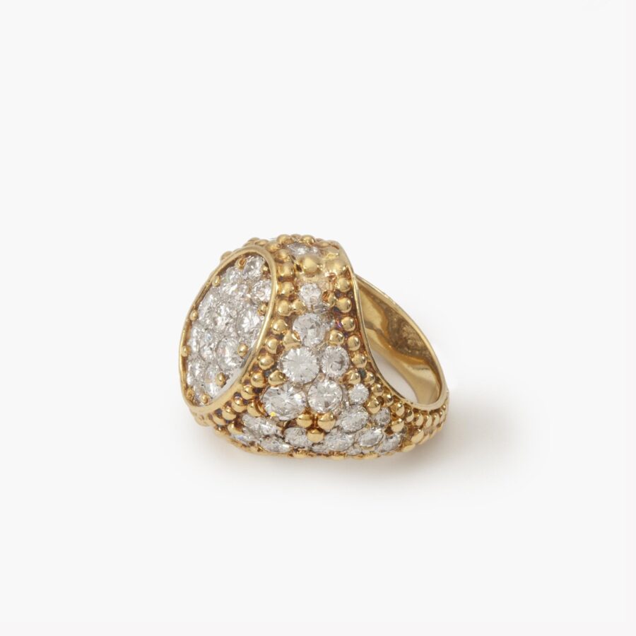 An eighteen carat yellow gold and platinum ring, pavé set with brilliant cut diamonds and with numerous spheres. Van Cleef & Arpels, Paris, ca 1970.