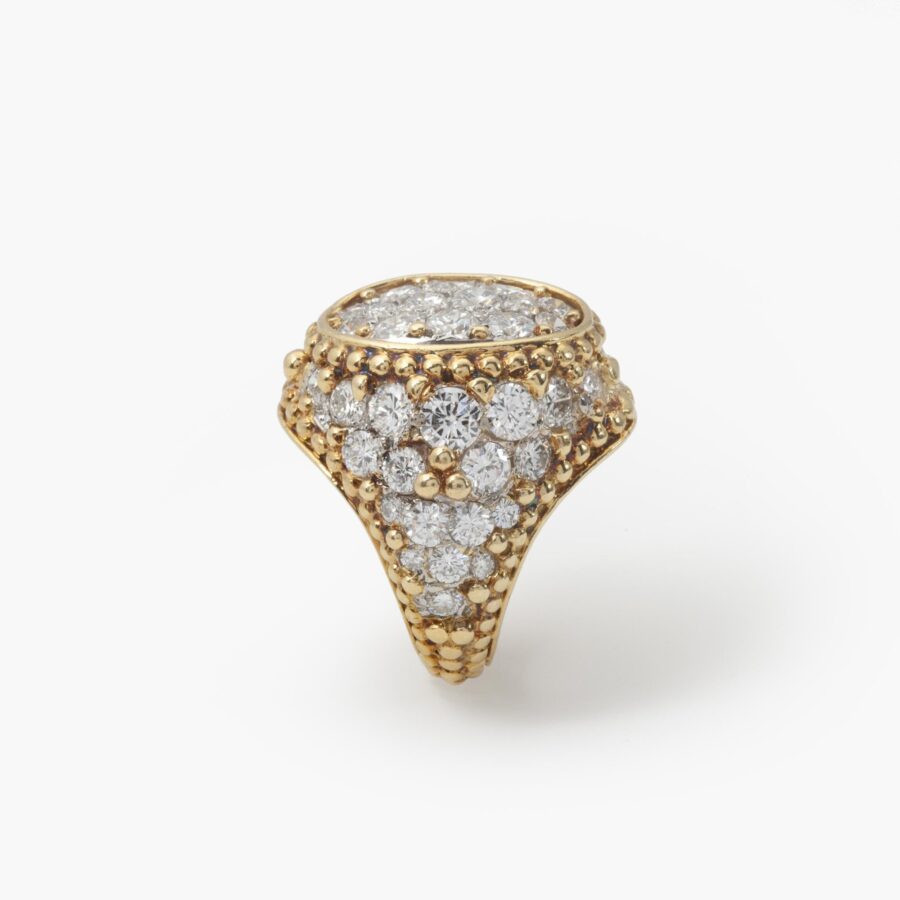 An eighteen carat yellow gold and platinum ring, pavé set with brilliant cut diamonds and with numerous spheres. Van Cleef & Arpels, Paris, ca 1970.