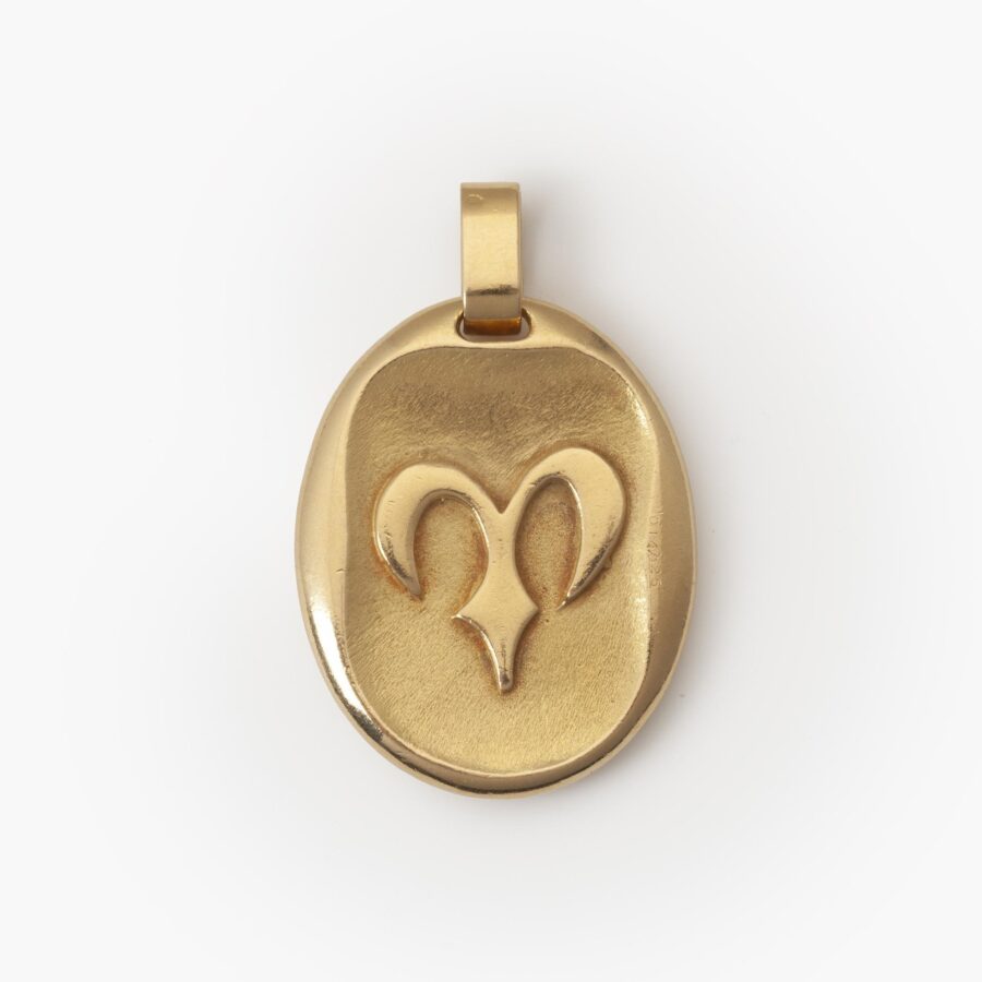 An eighteen carat yellow gold oval pendant, with the zodiac sign Aries. Signed Cartier Paris, made ca 1970 by Georges Lenfant, Paris, and numbered.