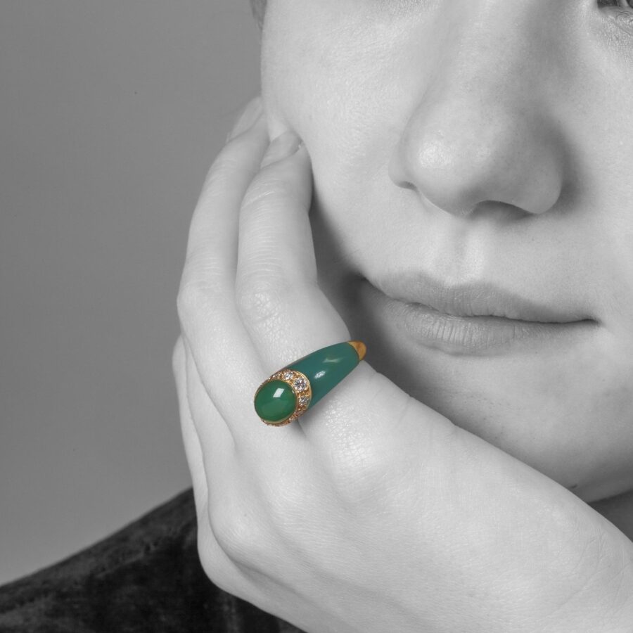 An eighteen carat yellow gold ring set with green agate and brilliant cut diamonds. Signed Van Cleef & Arpels, made in Paris, ca 1980 and numbered.