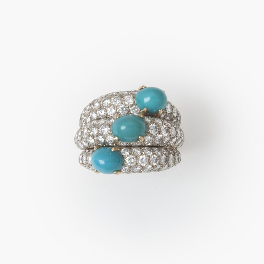 An eighteen carat yellow gold and platinum ring of triple bombé design, set with diamonds and turquoise. Signed Cartier Paris, made ca 1960.