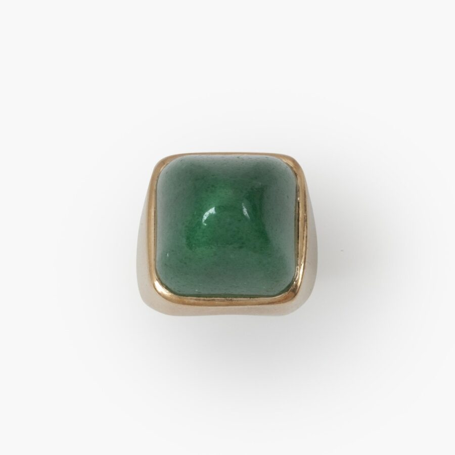 An eighteen carat yellow gold ring set with a high square cabochon cut aventurine. Signed Jean Fouquet, made in Paris, circa 1940.