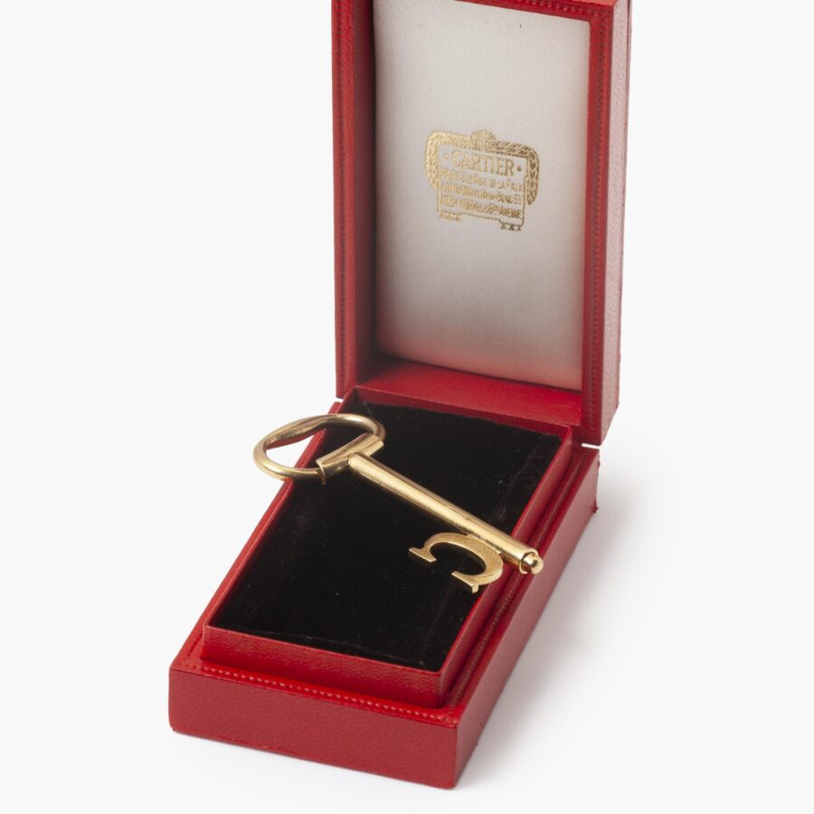 An eighteen carat yellow gold keychain/pendant, designed as a key. Signed Cartier, made in London in1976 and numbered. In original case.