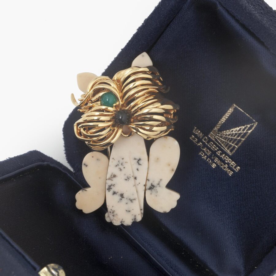 An eighteen carat yellow gold brooch designed as a terrier, carved from dalmatian jasper. Signed Van Cleef & Arpels, Paris. Dated 1972 and numbered.