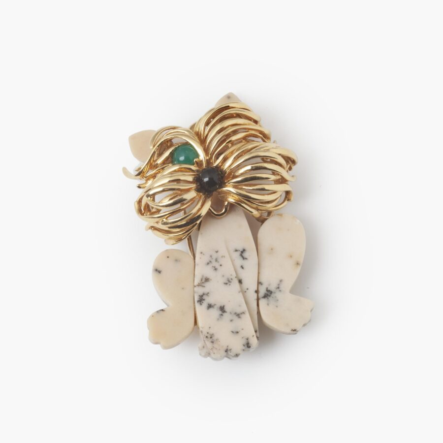 An eighteen carat yellow gold brooch designed as a terrier, carved from dalmatian jasper. Signed Van Cleef & Arpels, Paris. Dated 1972 and numbered.