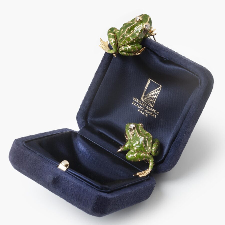 A pair of eighteen carat yellow gold brooches, each designed as a frog, with green enamel and diamond eyes. Signed Van Cleef & Arpels, Paris, 1966.